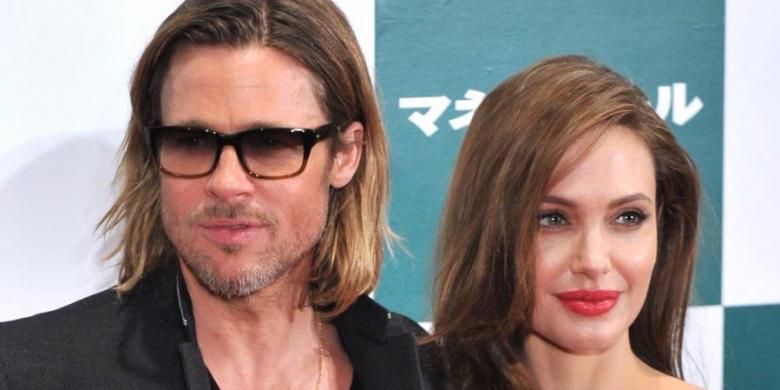 AFP PHOTO/KAZUHIRO NOGI Brad Pitt dan Angelina Jolie berpose untuk ...