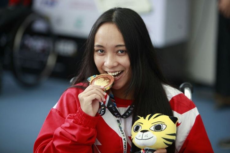 Laura Aurelia Dinda, tampil di nomor 100 meter gaya bebas di kelas S6, menjadi atlet pertama bagi Indonesia yang menyumbang medali emas di ajang ASEAN Para Games | kompas.com